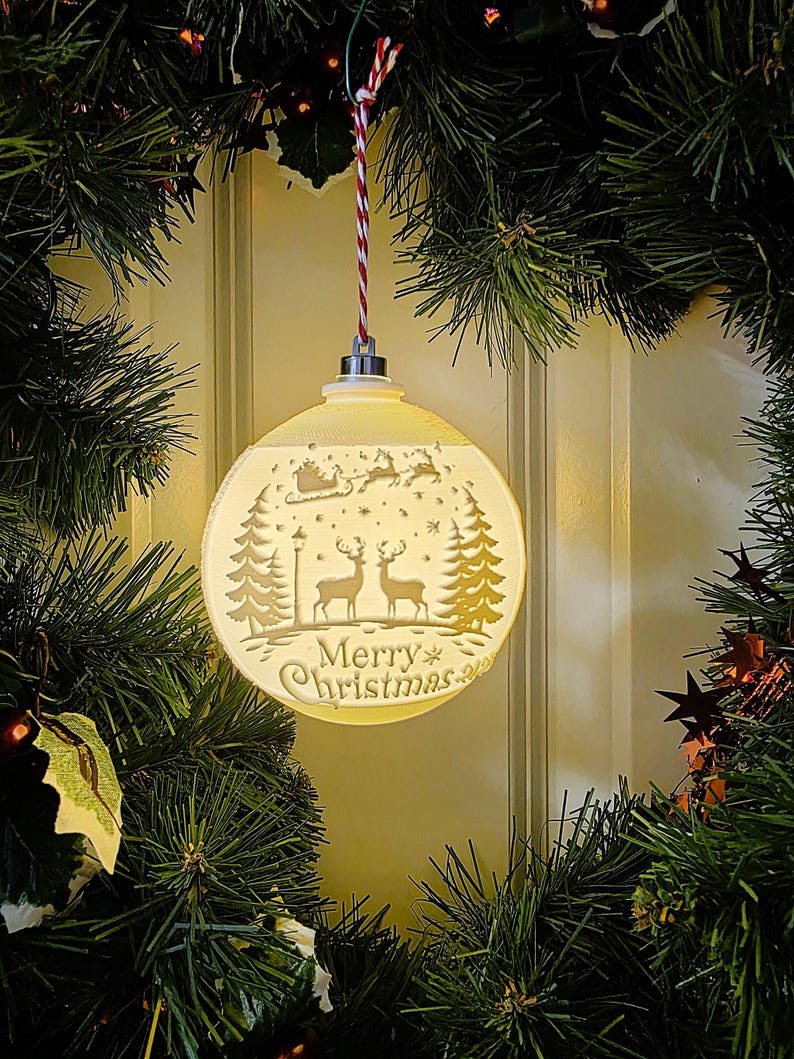 Glowing Merry Christmas lithophane ornament with Santa sleigh design